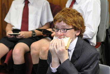 Chorister Patrick Manning fortifies himself for the feature duet, "Pie Jesu", with Dame Malvina Major.