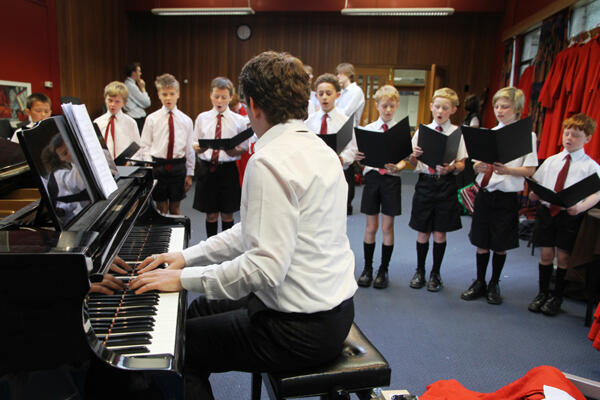 Jeremy Woodside, the Acting Director of Music at ChristChurch Cathedral, rehearsing the junior choristers at Christ's College.