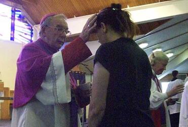 Bishop Barry Jones applies ashes to a worshipper at the Ash Wednesday service in Christchurch. Photo: Philip Baldwin