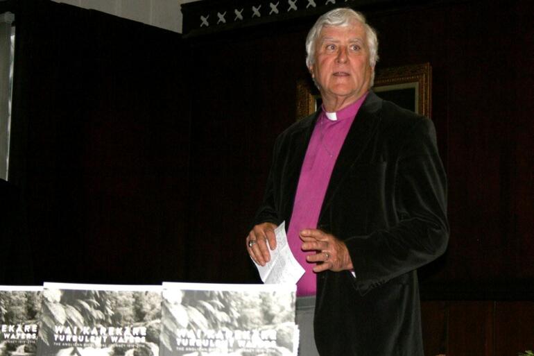 Bishop John Bluck, the author of Wai Karekare - Turbulent Waters, speaking at the book's launch.
