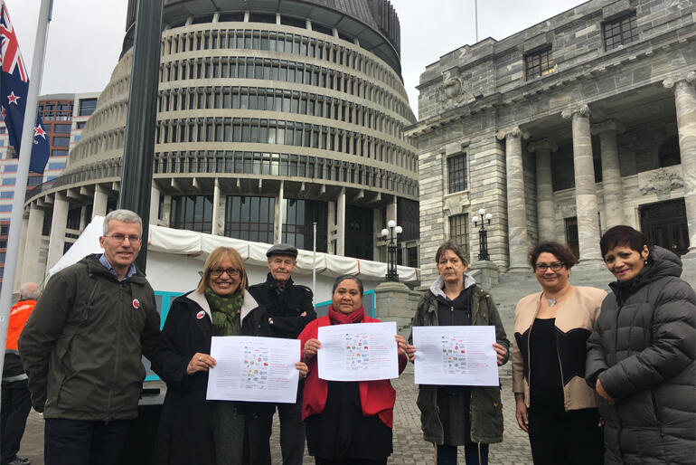 Representatives from the Equality Network present the three goals to MPs on the steps of Parliament today.