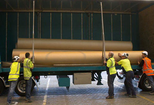Cardboard tubes for Christchurch's transitional cathedral are unloaded for coating in polyurethane. Photo: The Press.