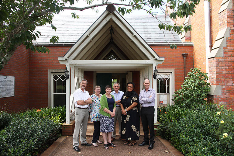 Judith and colleagues outside the Patteson Centre. The original library was in the building at right.