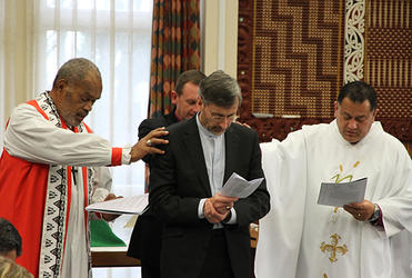 Bishops Api Qiliho, Ross Bay and Kito Pikaahu, representing the three archbishops, pray for the new Manukura.  