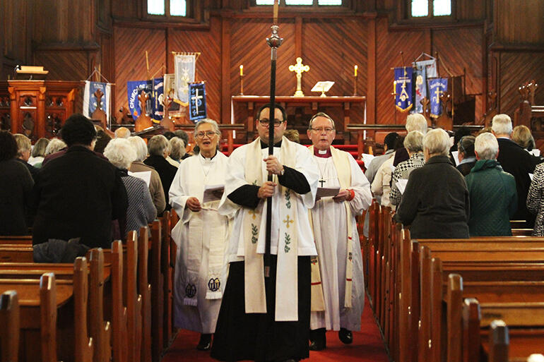 Processing from the church. The Rev Ivica Gregurec is the crucifer, and he's flanked by Rev Iritana Hankins and Archbishop John.