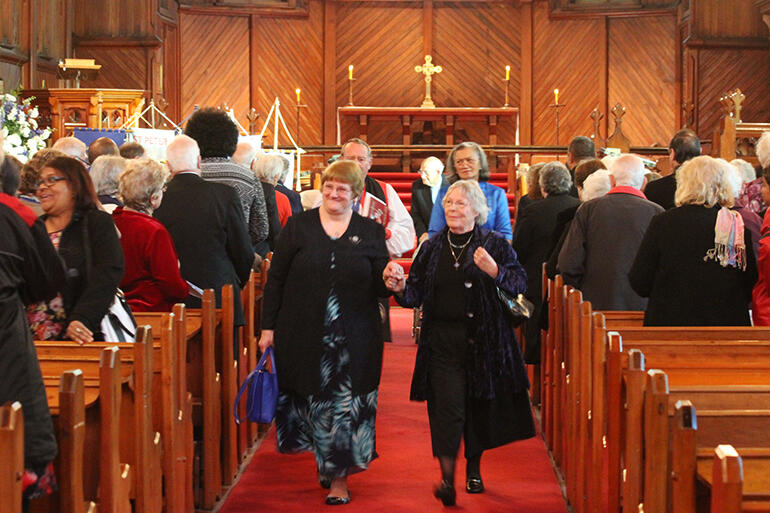 Hand in hand we go forward: MU Auckland Diocesan President Joan Neild escorts Lynne Tembey from St Mary's at the end of the meeting.