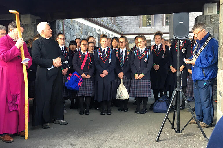 A song before the journey begins: That's Mayor Judd at right, St Mary's singers at centre, and Archbishop Philip and Dean Peter Beck at left.