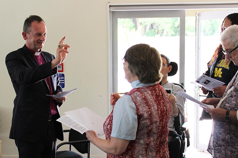 Bishop Ross blesses Vicki. All photos by Murray Wills.