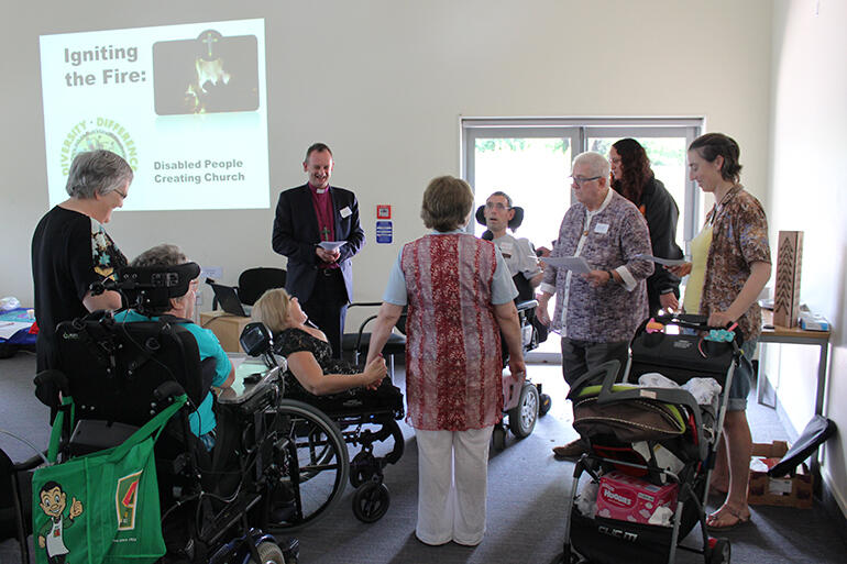 Supporters present Vicki to Bishop Ross, who led her through her commitments to ministry.