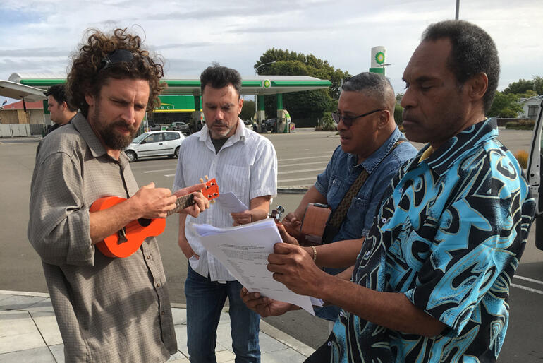 Students grab a quick waiata practice in Bulls on route to St Michael's.