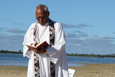 Archbishop Winston Halapua leads an open-air Eucharist for the bishops at their conference on the island of Pangaimotu, in Tonga.