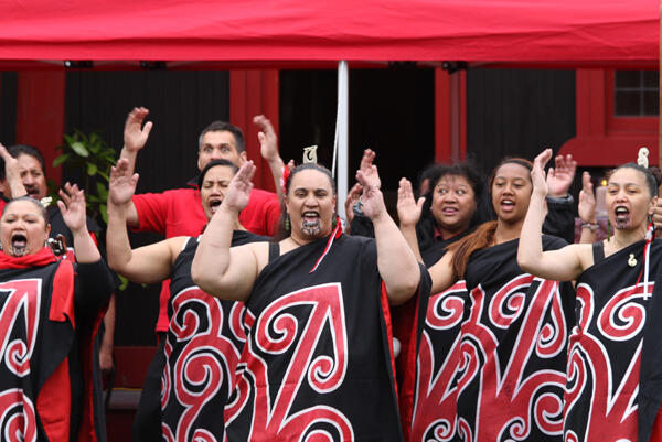 Wahine from the home side call the manuhiri on to the marae.