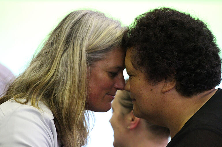 Jax Clark and the Rev Hannah Pomare - who is a Youth Commissioner - exchange hongi.