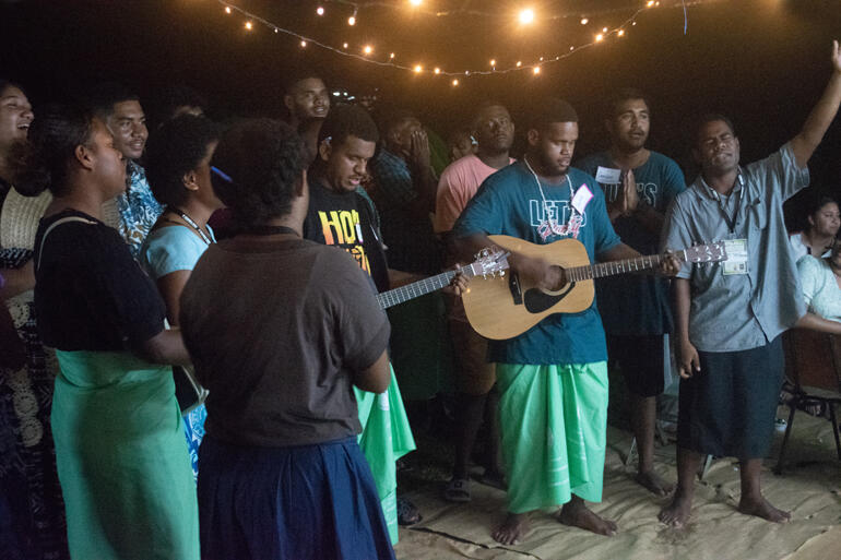 Lotu Youth Mission members lead singing at TYE in Fiji.
