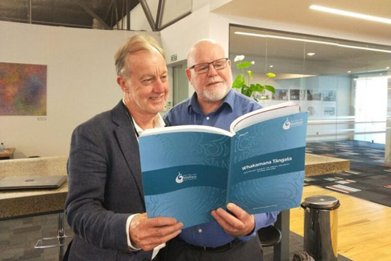 Auckland City Missioner Chris Farrelly looks over the Whakamana Tāngata report with NZCCSS Executive and WEAG member Trevor McGlinchey. Photo: NZCCSS.