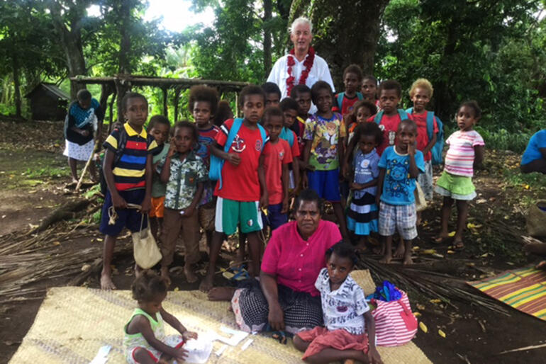 Anglican Missions Board shot - Mike Hawke earlier this year with villagers at Pentecost, Vanuatu.