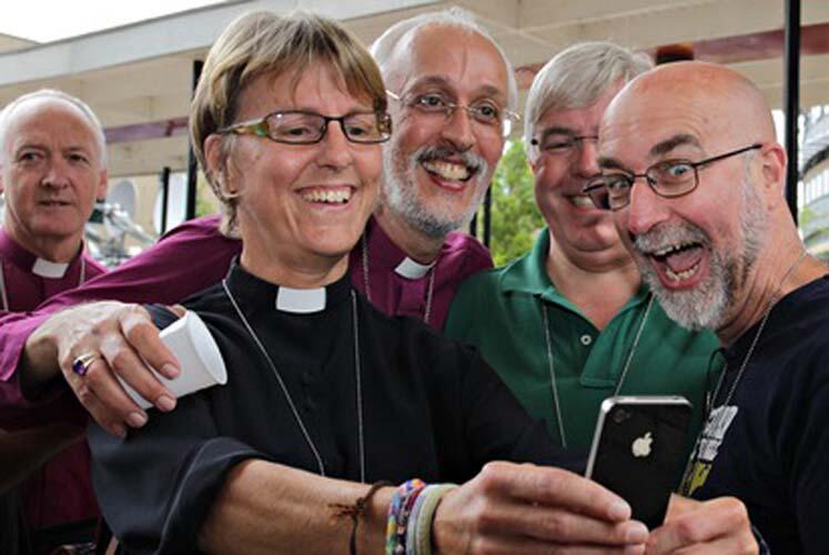 Clergy at the Church of England synod in York take a 'selfie' as they celebrate the vote to allow female bishops. Photo: Lindsey Parnaby/AFP/Getty