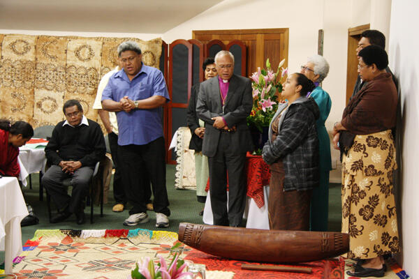The Diocese of Polynesia delegates to the consultation pray and sing before their Archbishop's Wednesday evening contribution.