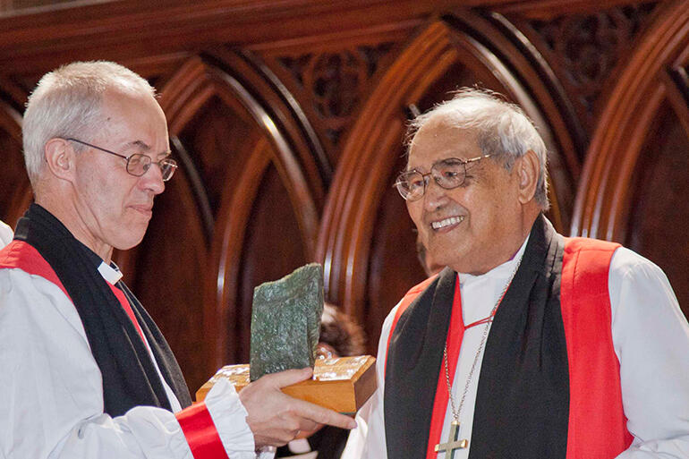 August 15, 2014 - Archbishop Brown presents a gift of pounamu to the Archbishop of Canterbury during his flying visit to Auckland.