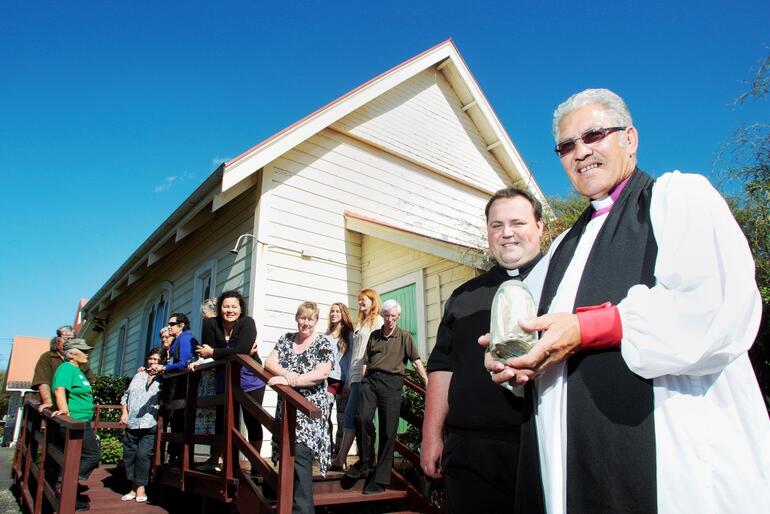 Bishop Ngarahu and Father Simmonds with the time capsule uncovered at Hemi Tapu (St James). Photo: Taranaki Herald