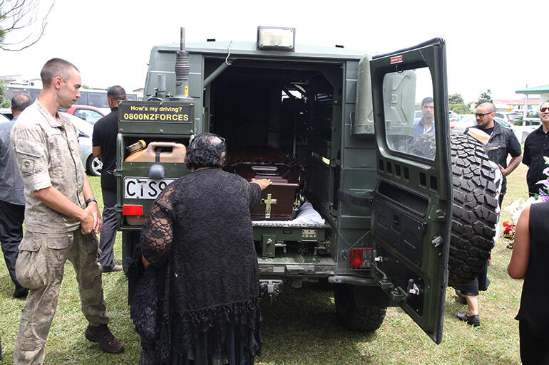 Archbishop Brown was loaded into an Army vehicle for his final journey.