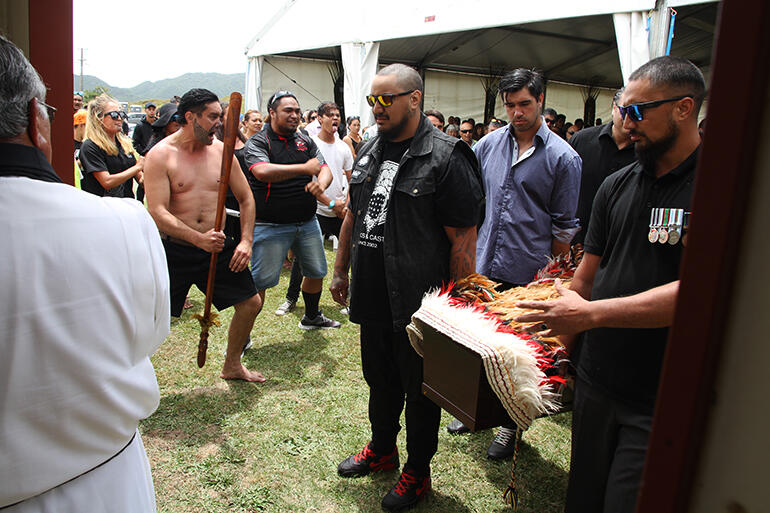 As the pallbearers were about to pass through the waharoa, the haka rang out.