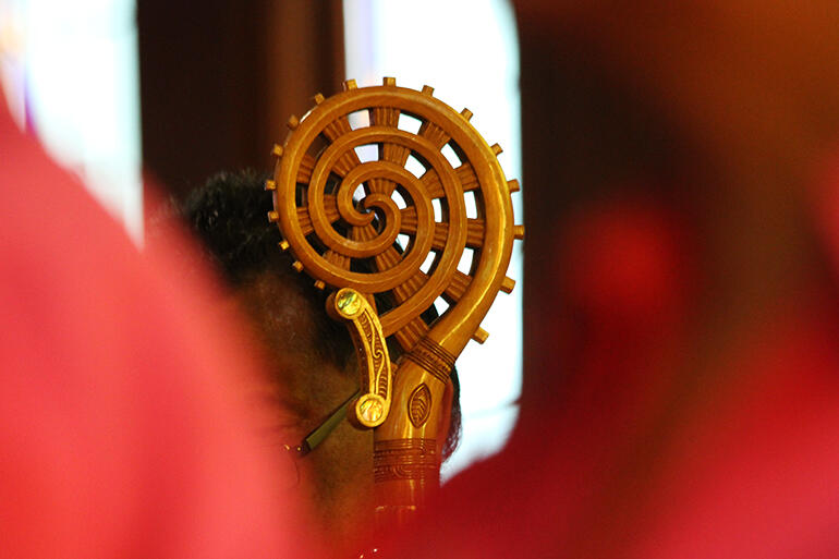 The delicate whakairo of Te Puna Ora, the spring of life symbol on the crozier