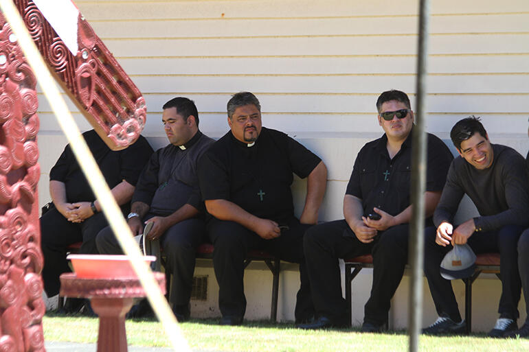 The next bishop of Te Tairawhiti (centre) listens to the whaikorero.