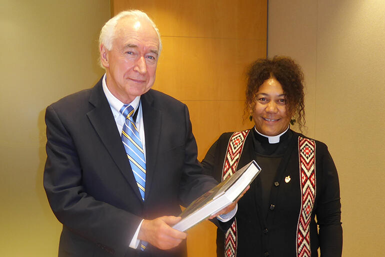 New Zealand's Permanent Representative at the UN, Jim McLay, receives the Aotearoa delegation's gift from Rev Ngaio Keelan.