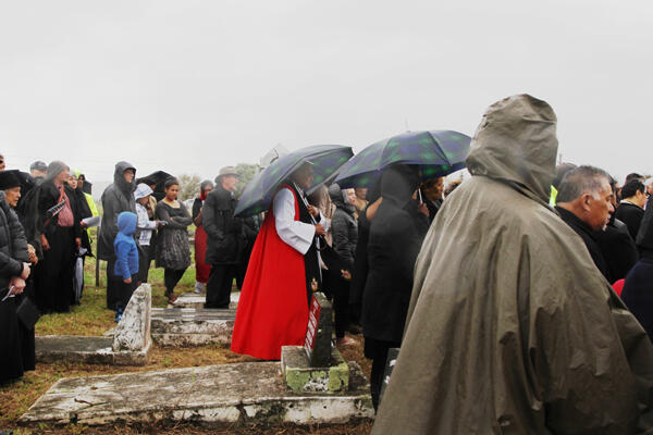 Archbishop Brown Turei looks on at the graveside.