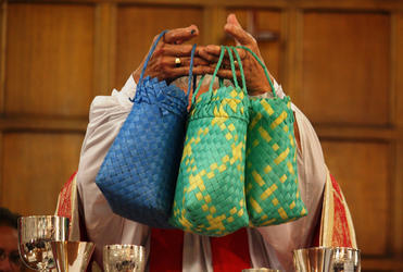 Bishop Rahu gives thanks for the offerings.