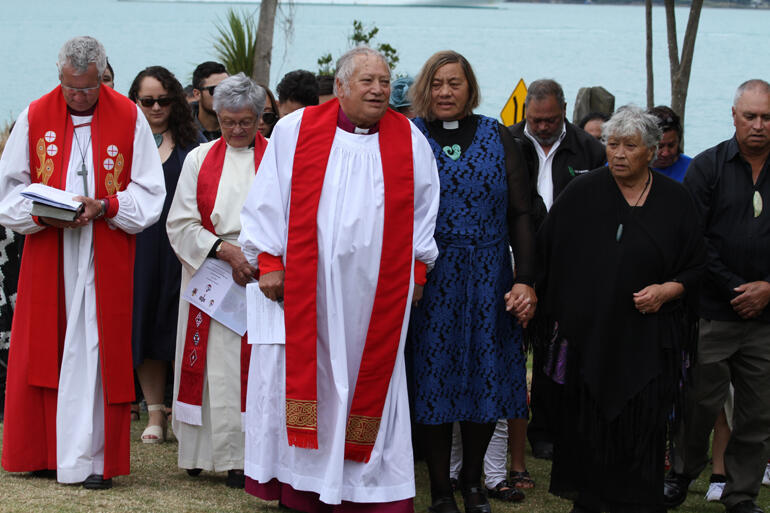 Bishop-elect Richard walks on to Onuku with his wife Mere and whanau.