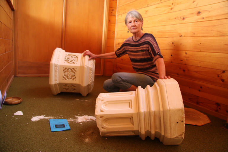 Hilary Ellena looks over the toppled font at St Michael's Clarence, which has now been rezoned into Awatere parish by the earthquakes.