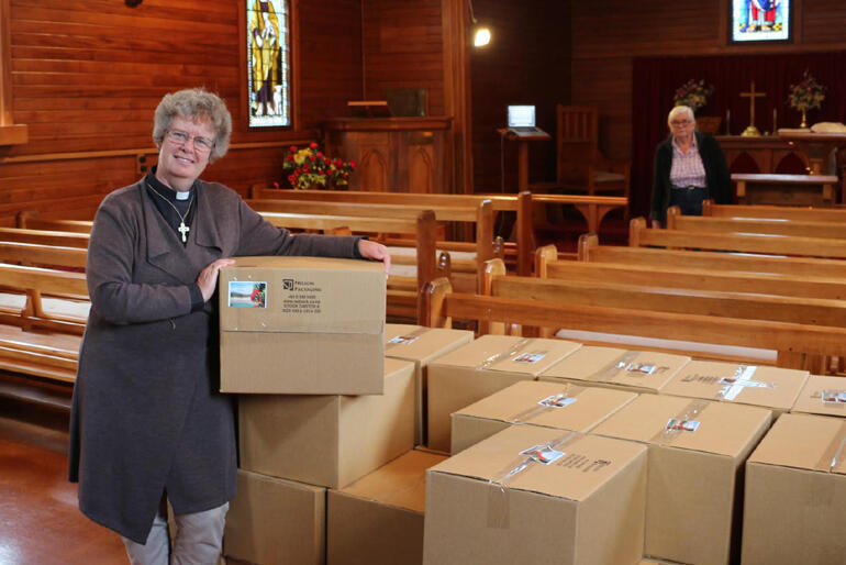 Inside St Peter's Ward: The Rev Dawn Daunauda and Catherine Gullidge ready hampers for families living in the quake-zone.