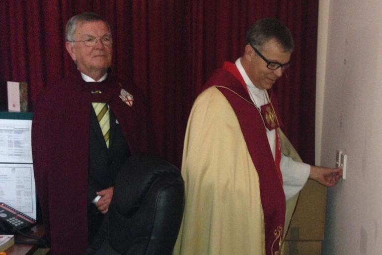 At the flick of a switch: Digby Wilkinson rings in his installation of Wellington's 7th Dean. Counting him in is People’s Warden Tony Fryer. 
