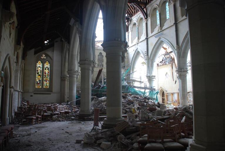 Looking west. The cathedral's main doors are submerged in rubble from the Rose Window.