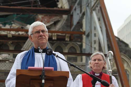 Dean Peter Beck at a service last year in front of the damaged cathedral. Photo: Lloyd Ashton