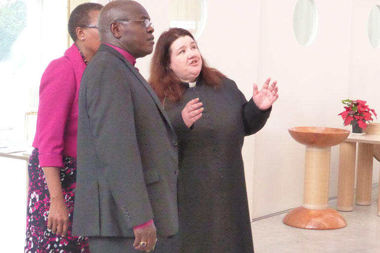 Dean Lynda Patterson explains features of the Transitional Cathedral to Archbishop John and Margaret Sentamu.