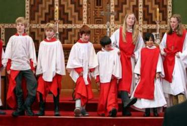 The Waiapu Cathedral choir dons gumboots in sympathy with Christchurch. Photo: Glenn Taylor 