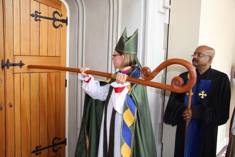 The ancient rite of installation. Bishop Helen-Ann strikes the door of the cathedral three times with her pastoral staff, and the doors are opened.