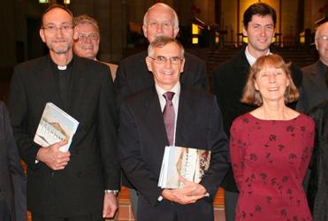 Chris Honore and Allan Davidson holding their copies of Living Legacy, the new Auckland diocesan history.