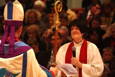 Dean Jo Kelly-Moore recites her vows last night to her Bishop, the Rt Rev Ross Bay.
