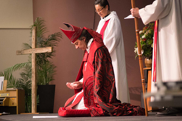 Bishop Justin praying for the invocation of the Holy Spirit during the singing of Veni, Creator Spiritus.