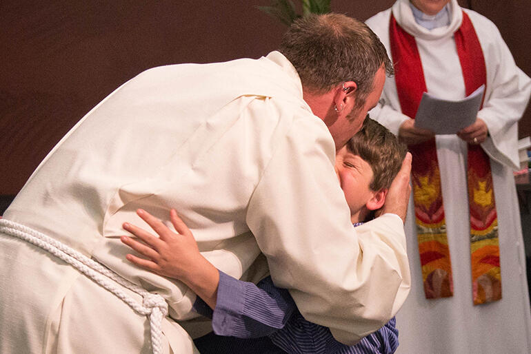 Maximum love: Dr Joe McGarry and his son Duncan. Joe is now a cathedral deacon.