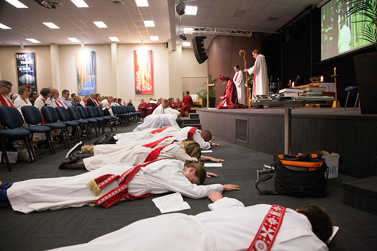The ordinands prostrate themselves as they seek the Holy Spirit's empowering of their ministries.