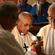 Bishop Muru Walters reflects, while Archbishop Brown Turei serves the chalice to Bishop Ngarahu Katene.