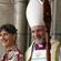 The new bishop and his wife respond to wellwishers outside the main entrance to the cathedral.