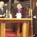 Kevin Rudd lights a candle for victims of the Christchurch quake. Looking on are Bishop Victoria and Father Peter Williams.