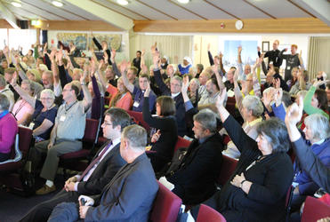 A section of the Synod showing their support for the contemporary cathedral option. The two men in front are consultants.