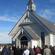The congregation gathers at the front of Morven Church at the end of its closing service on May 20.